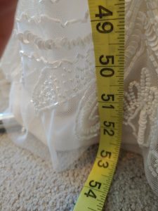 measuring tape and a wedding dress