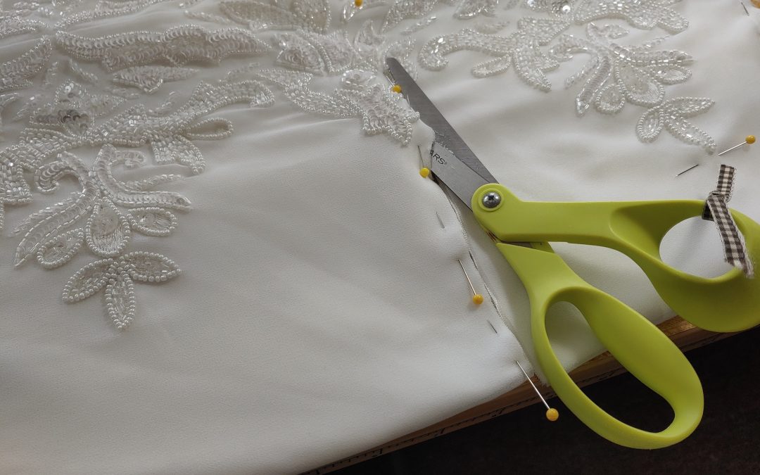 hemming from the waist with a pair fo scissors