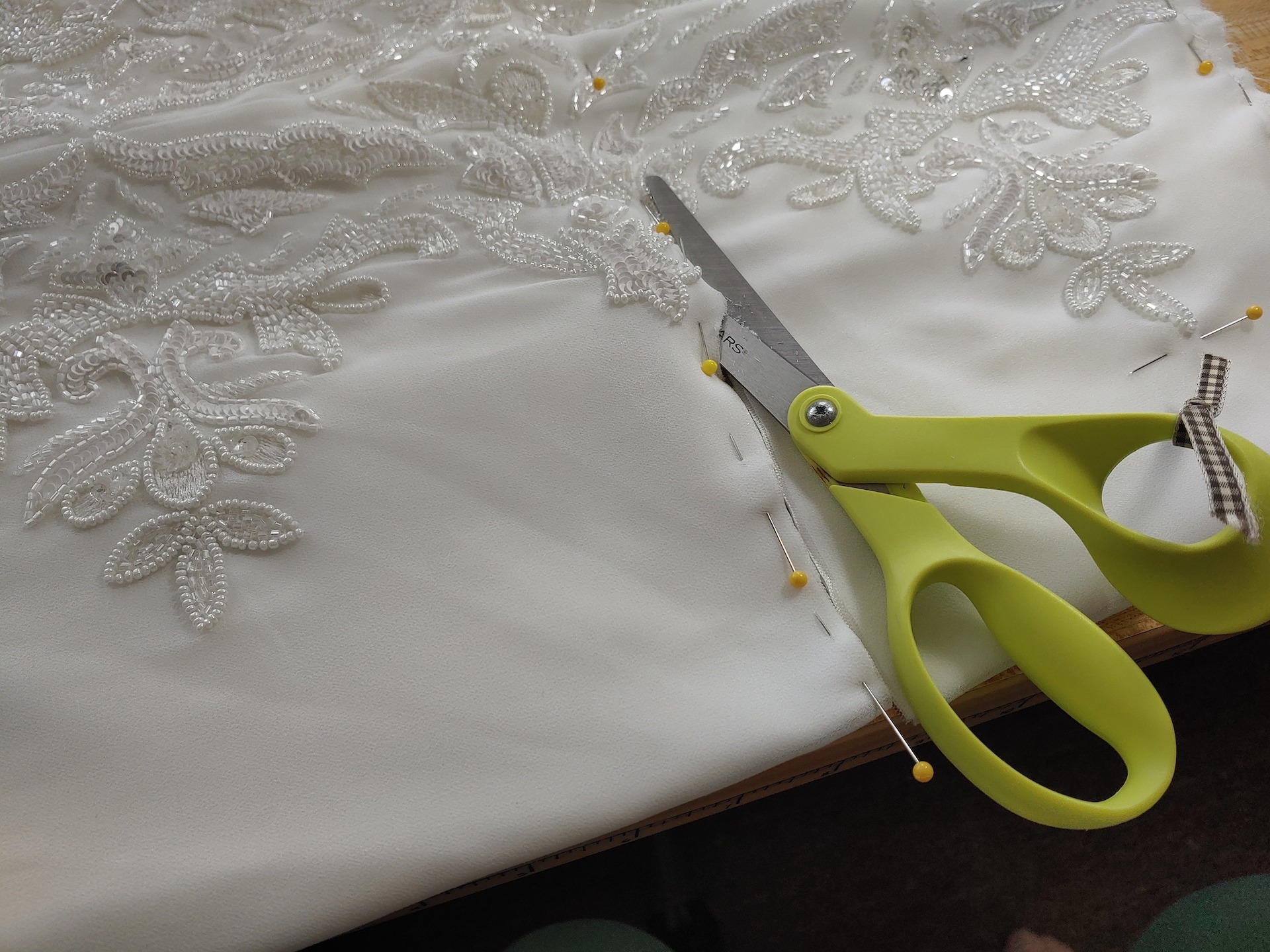 hemming from the waist with a pair fo scissors