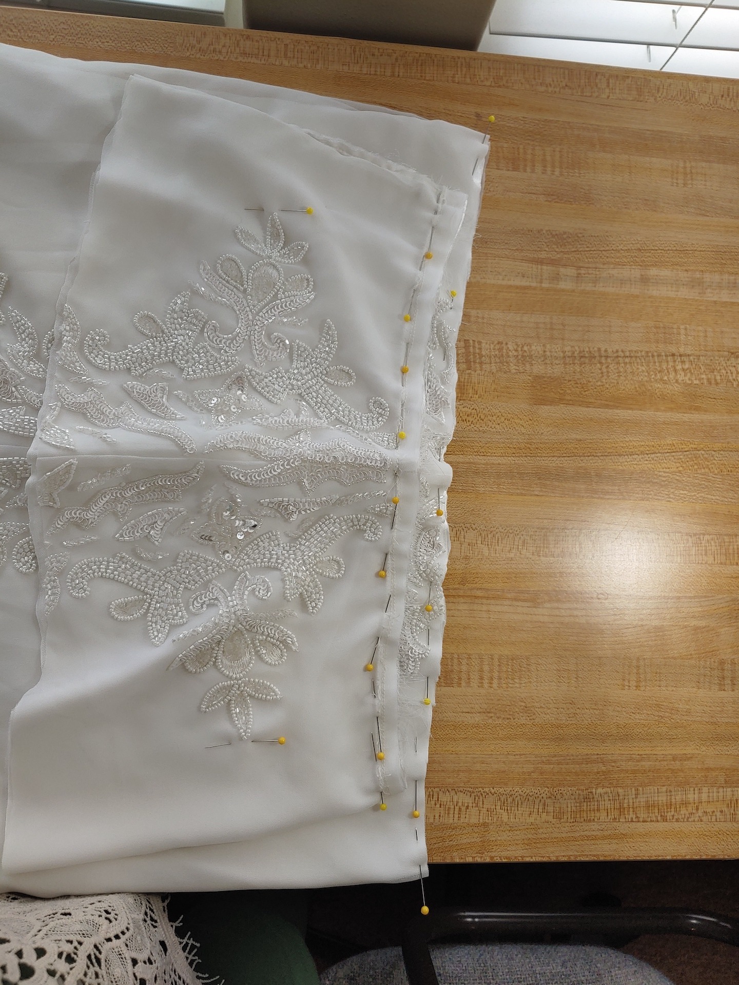 the waist line of a wedding dress having the hem altered