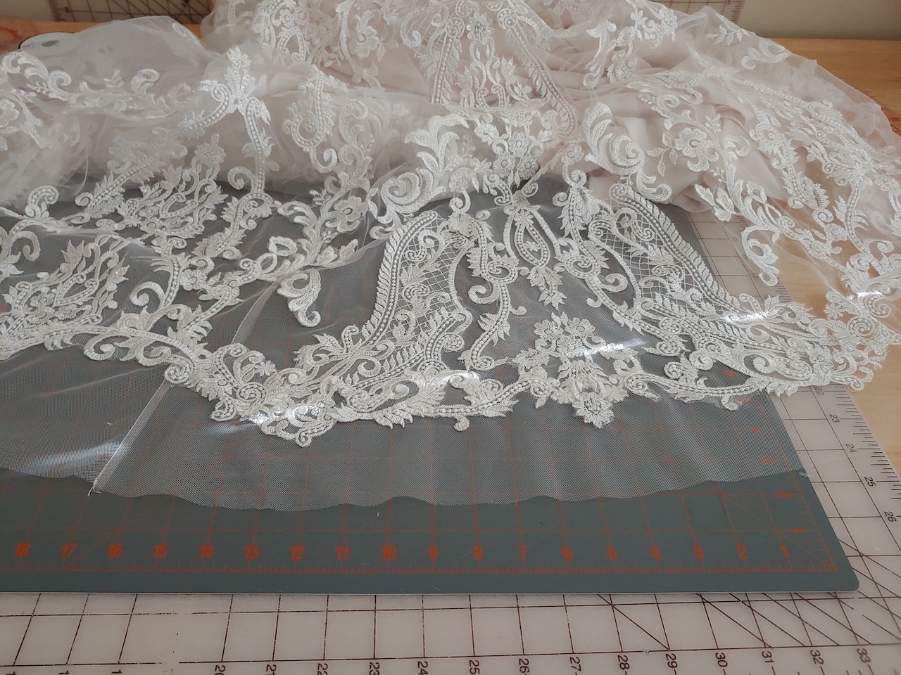 The hem of a wedding dress after alterations are completed