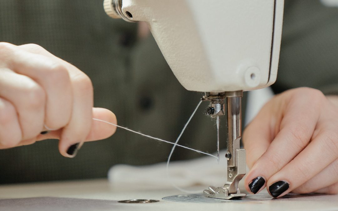 a seamstress working at a sewing machine