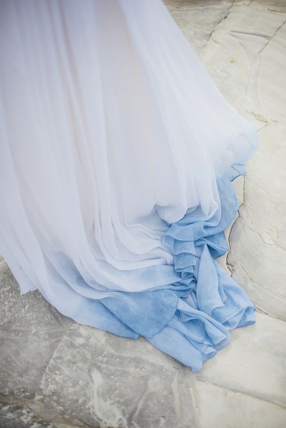 the train of a white and blue wedding dress