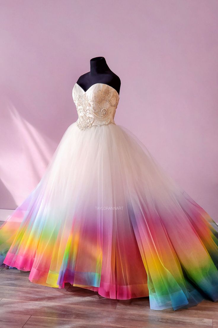 a wedding dress with a rainbow skirt