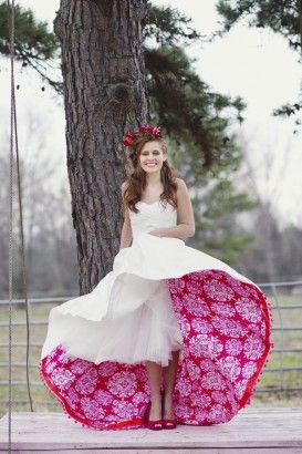 a woman in a white dress with pink underneath