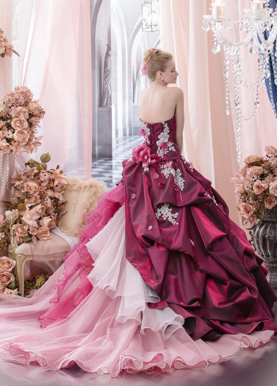 a woman in a pink and red wedding dress