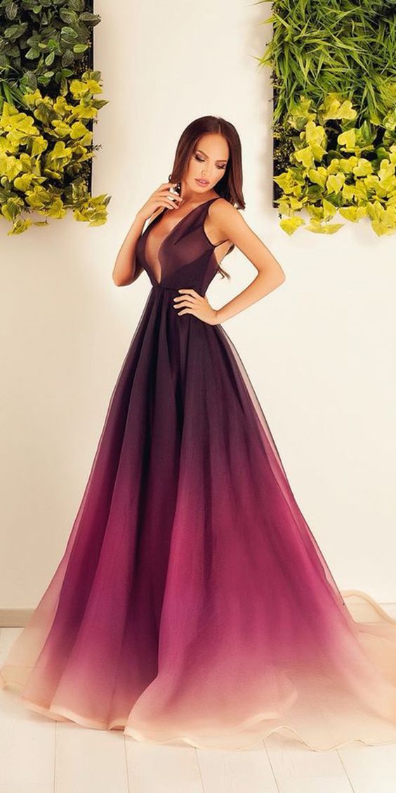 a woman in a dark purple and magenta wedding dress